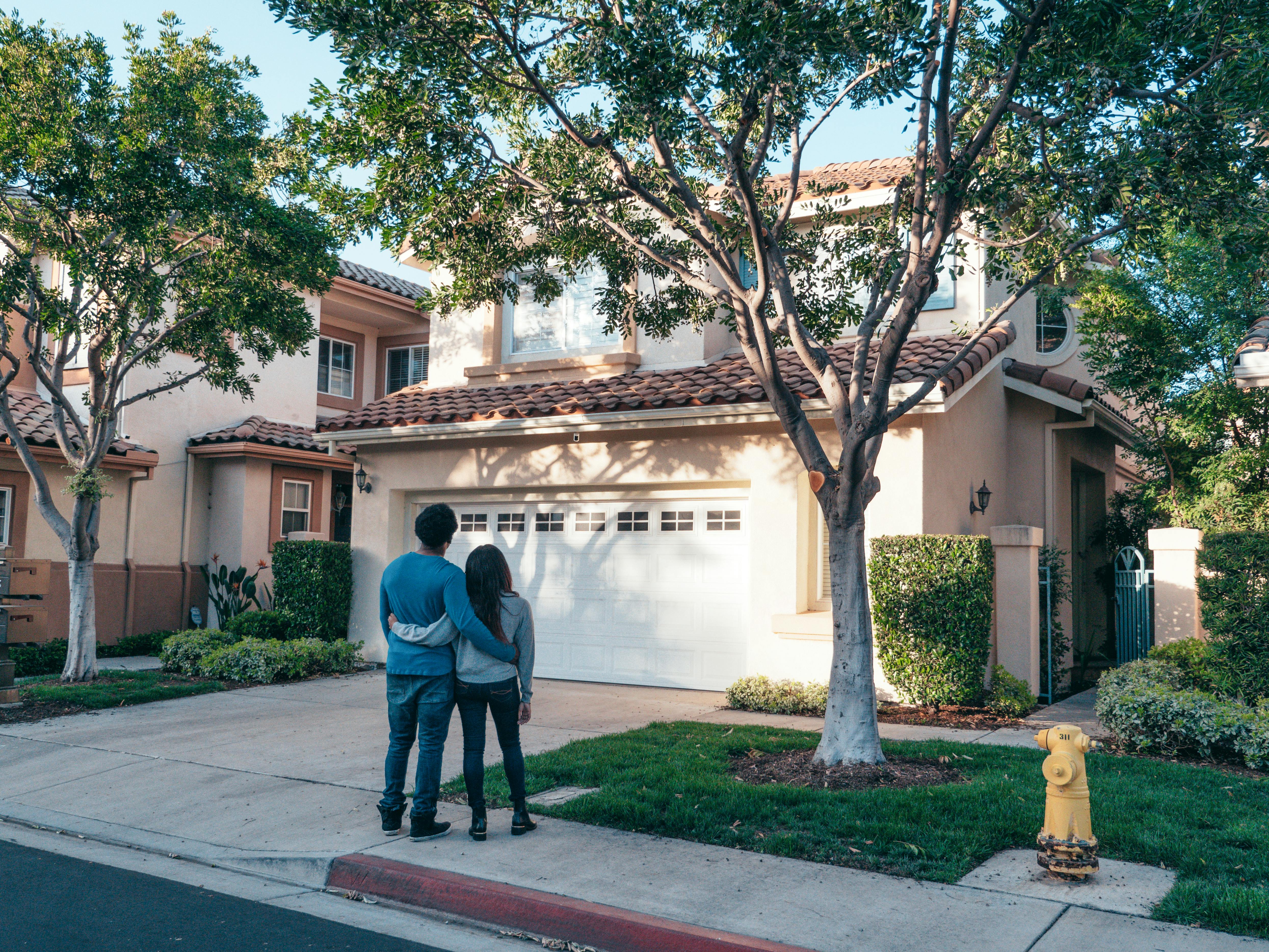 Couple In Front of House